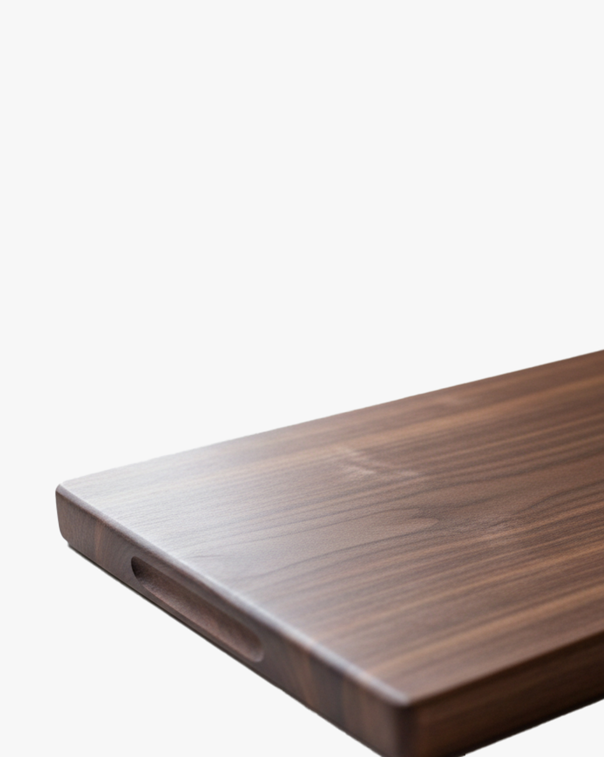 Corner of a walnut board with a carved finger grip