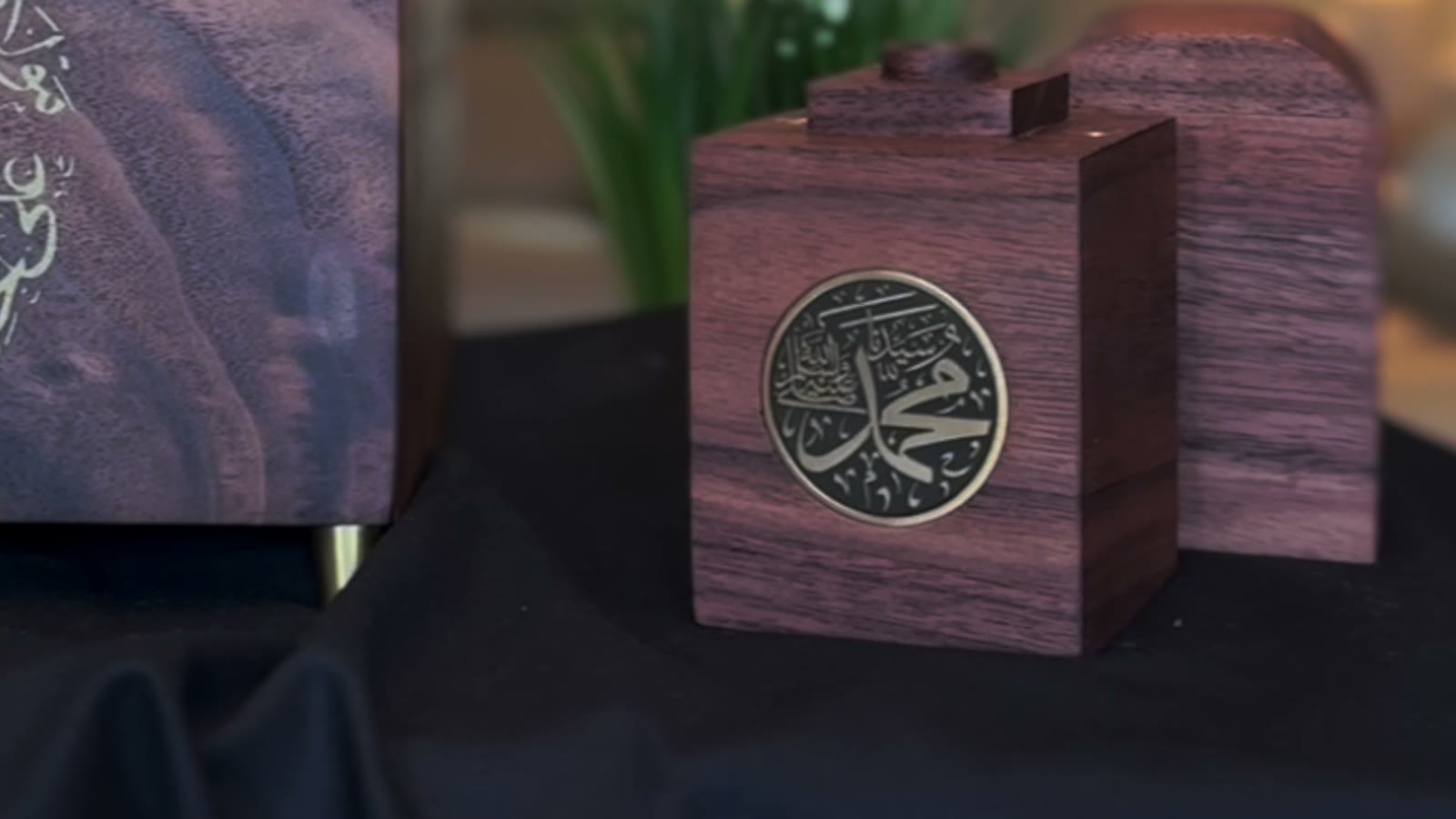 Walnut display pieces with gold-filled calligraphy medallions